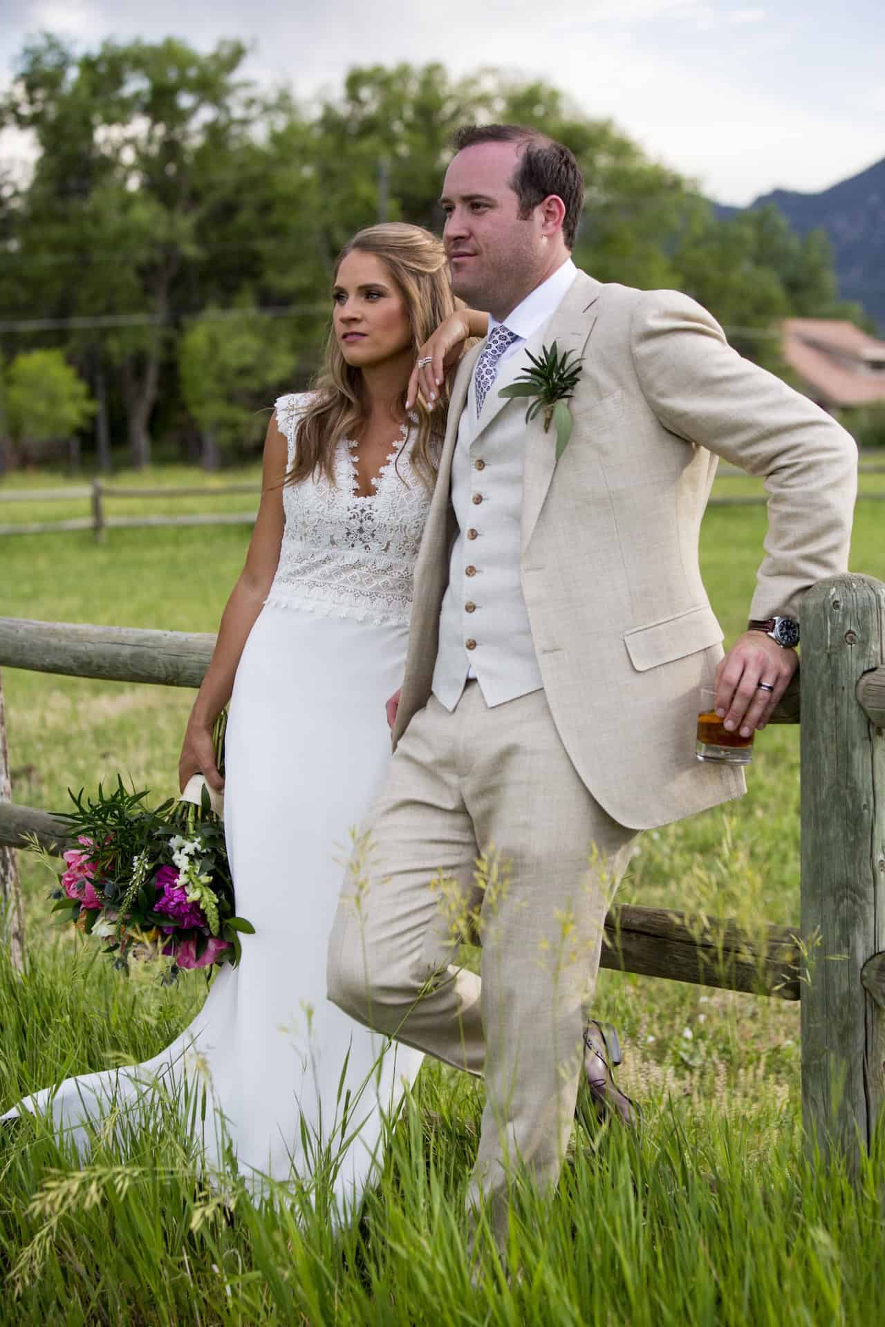 Beautiful wedding couple outdoors with scenic mountain background.