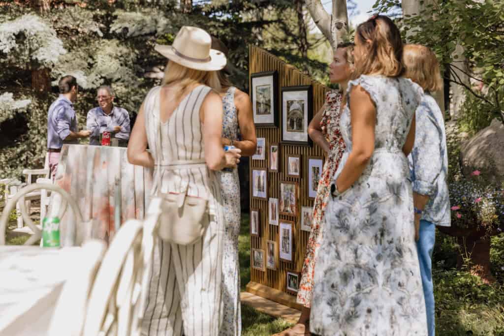 Guests viewing photo display at Martha's Celebration of Life event.