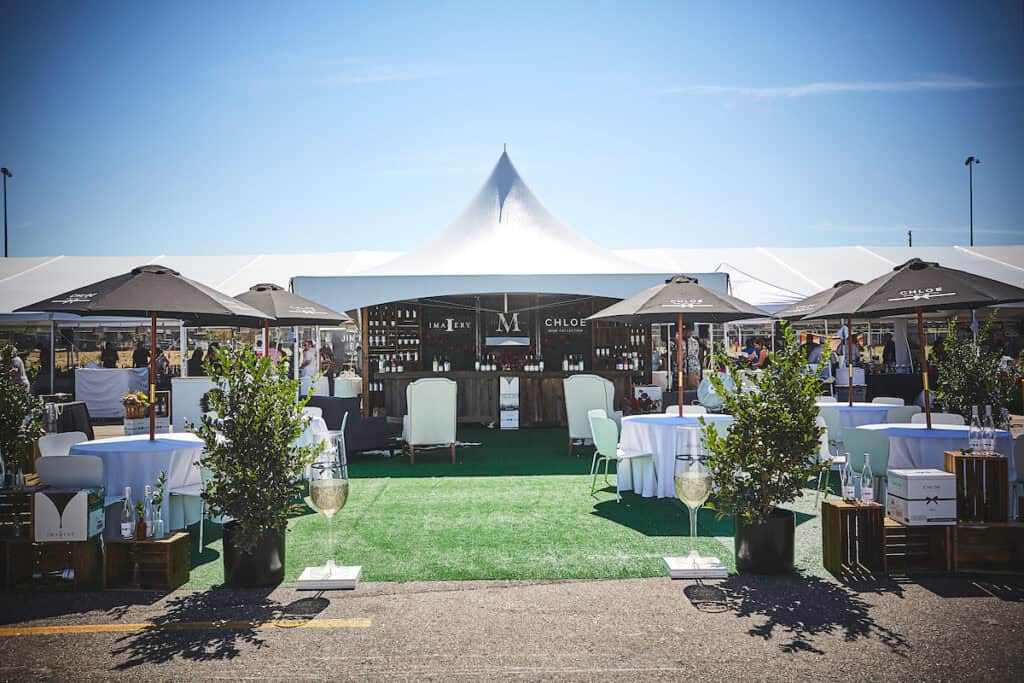 Elegant outdoor event setup at Blank Space Events during Denver Food & Wine festival.