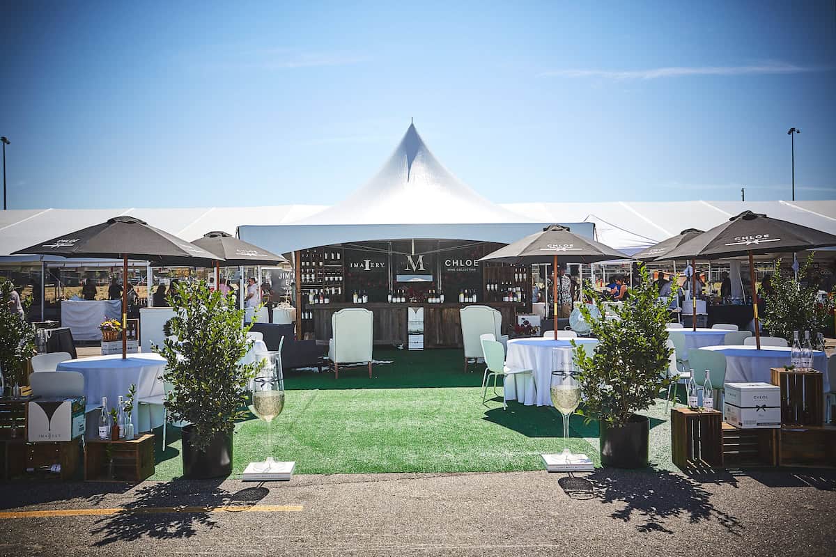 Elegant outdoor event setup at Blank Space Events during Denver Food & Wine festival.