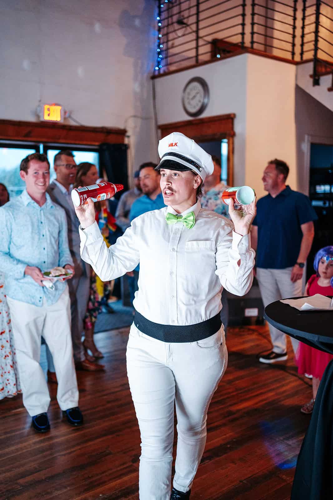 Drag performer in sailor costume entertaining at Gay + Social event.