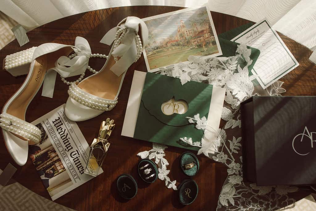 Elegant wedding shoes, invitations, and accessories for a luxury wedding.